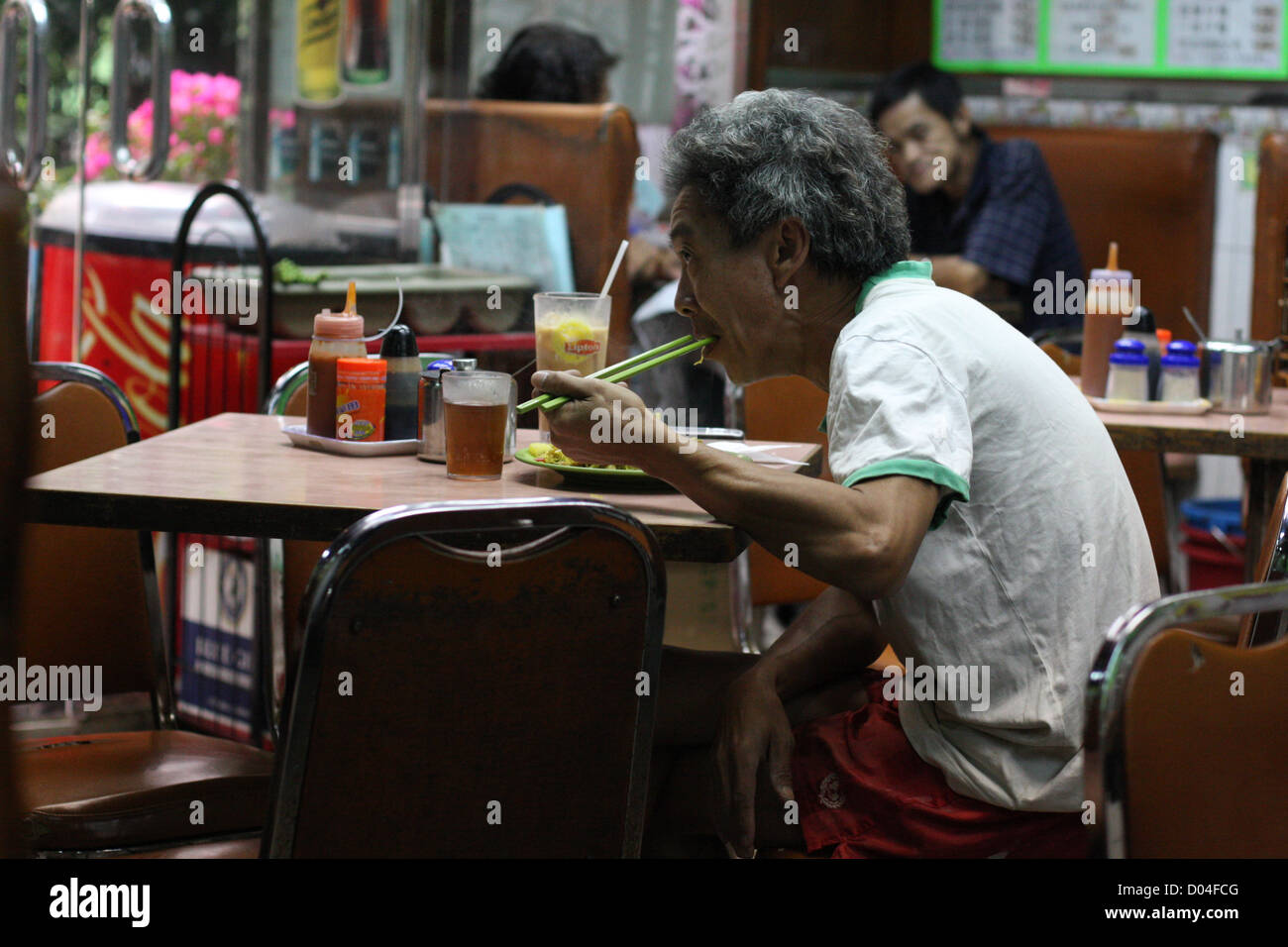 man in cafe, Kowloon, Hong Kong Stock Photo
