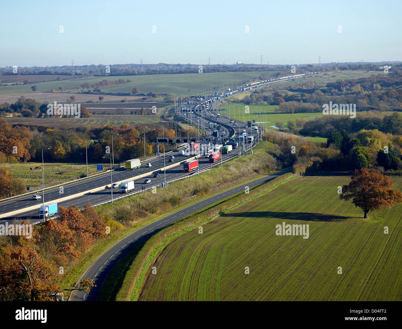 M25 Motorway widened to four lanes in Essex, close to the Junction with the M11, South East England, UK Stock Photo