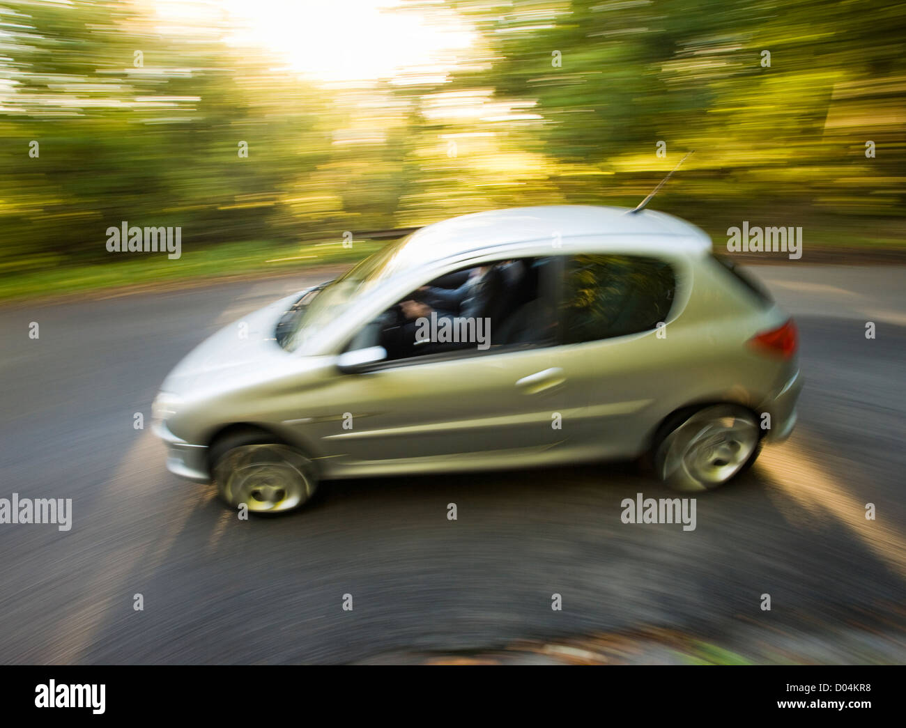 Car going round sharp bend. Stock Photo