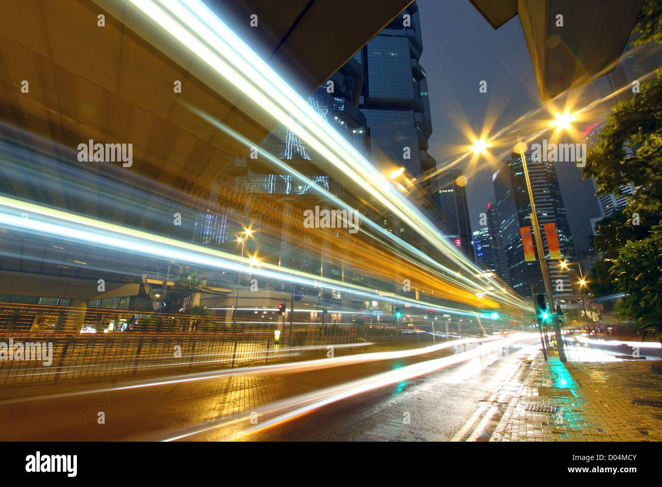 Traffic through downtown of Hong Kong at night in rainy day Stock Photo ...