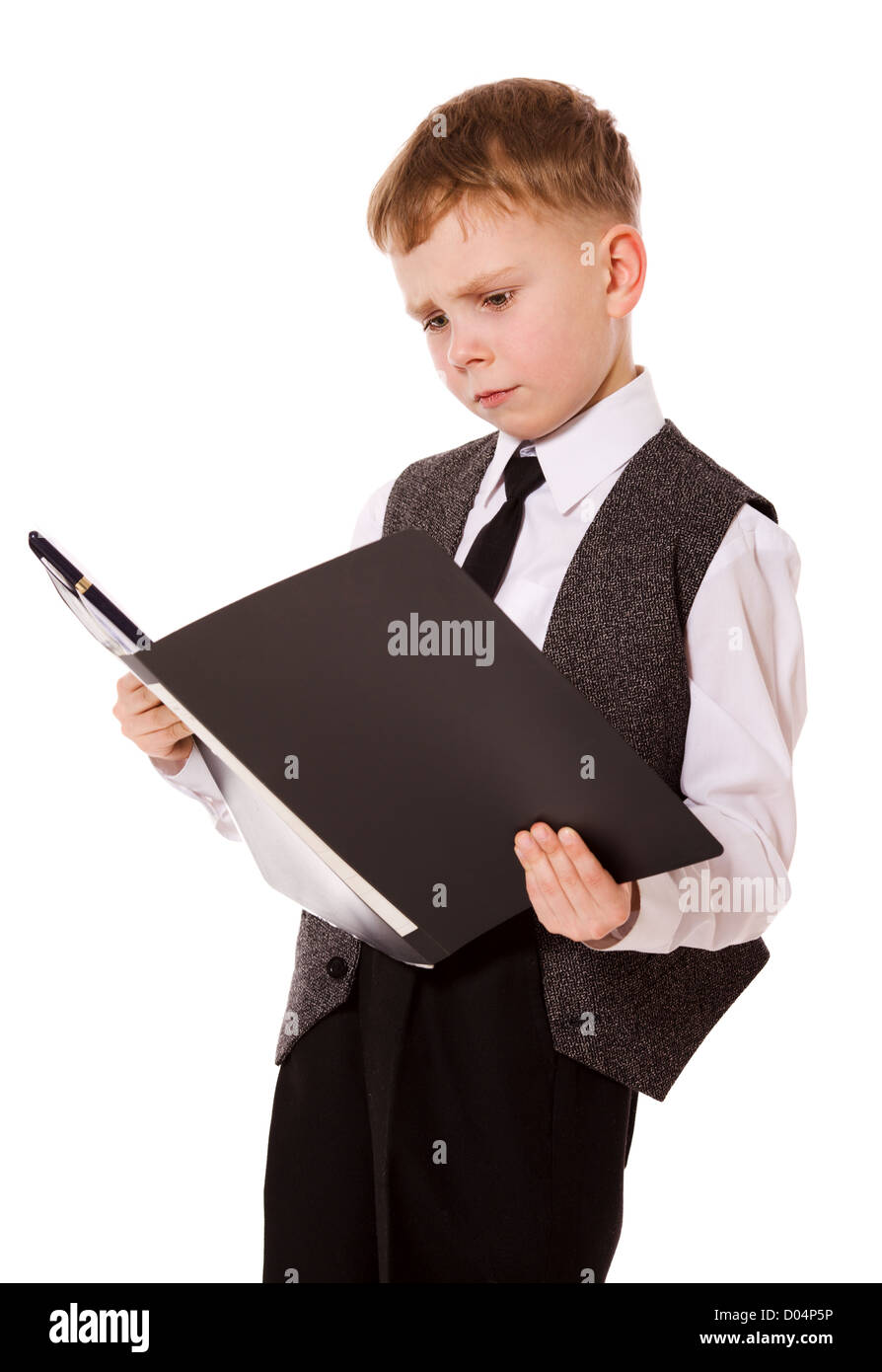 little serious boy reading isolated on white Stock Photo