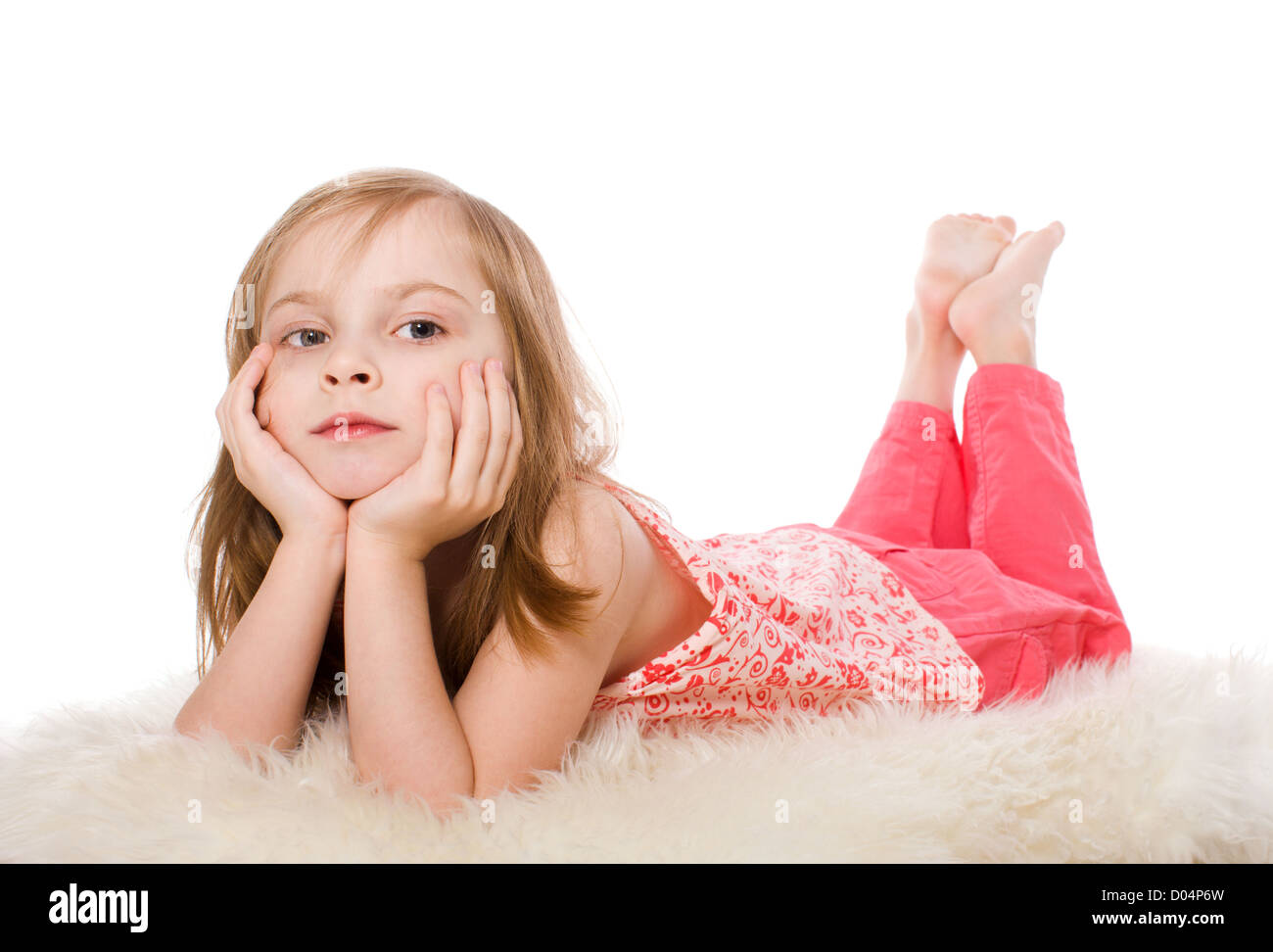 Lying little girl happy isolated on white Stock Photo - Alamy