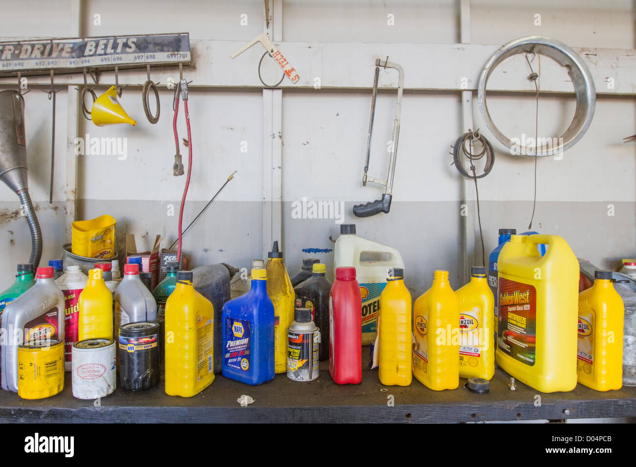 Oil cans in a car garage. Stock Photo