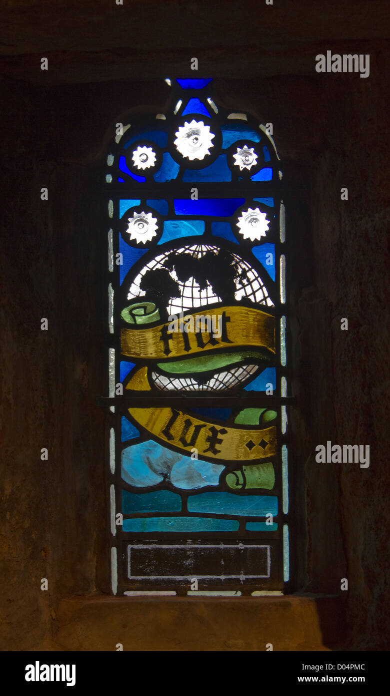 A beautiful, small stained glass window in the upper levels of St Magnus Cathedral, Kikwall, Orkney. Stock Photo