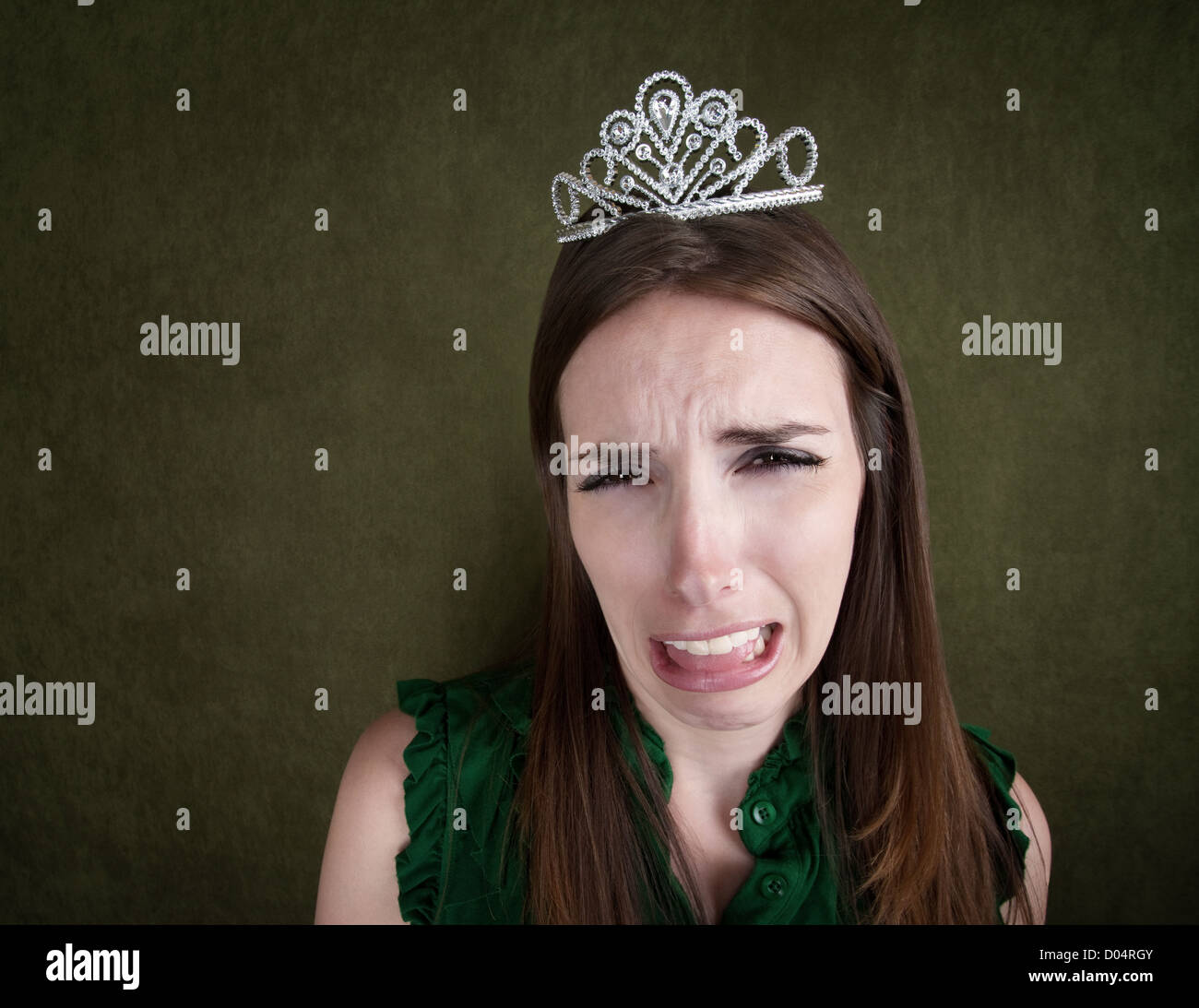 Crying young Caucasian woman with a tiara Stock Photo