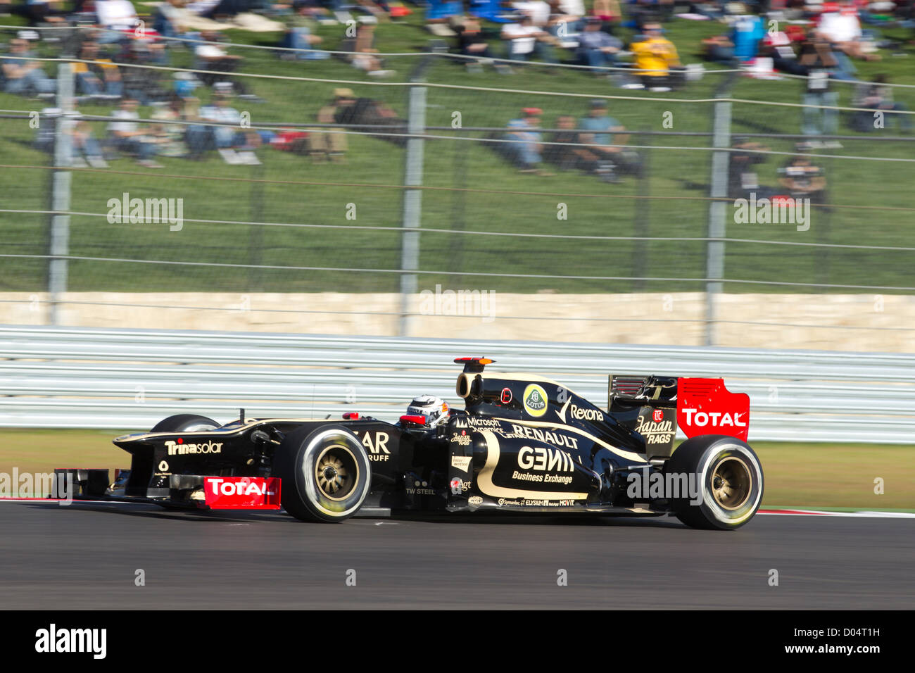 Driver Kimi Raikkonen handles his Lotus F1 car during practice for the United States Grand Prix at Circuit of the Americas Stock Photo