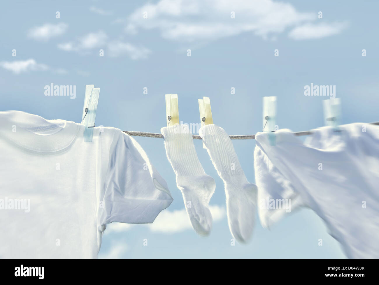 Clothes hanging on wash line Stock Photo - Alamy