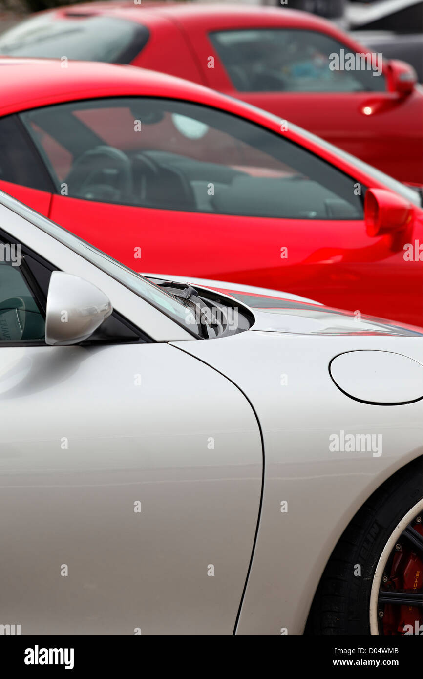 three sport cars in a garage for sale Stock Photo Alamy