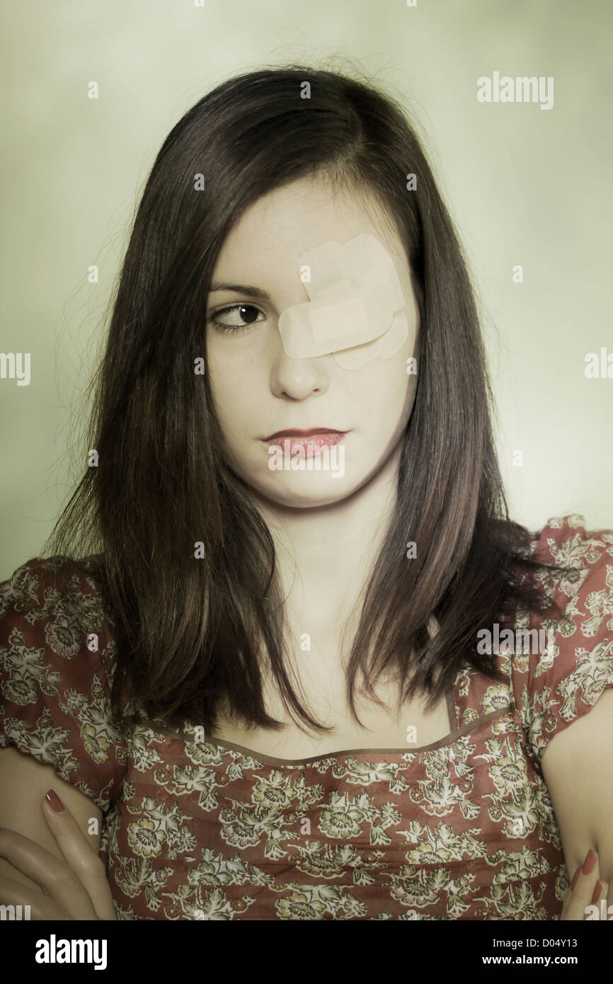 a girl with patches on one of her eyes Stock Photo Alamy