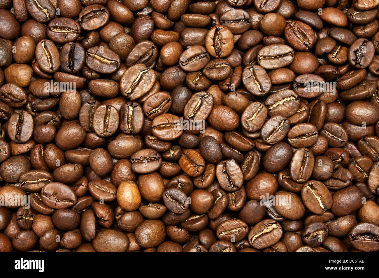 Roasted coffee beans background, closeup Stock Photo