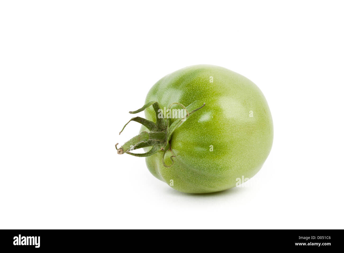 Green tomato isolated on white background Stock Photo - Alamy