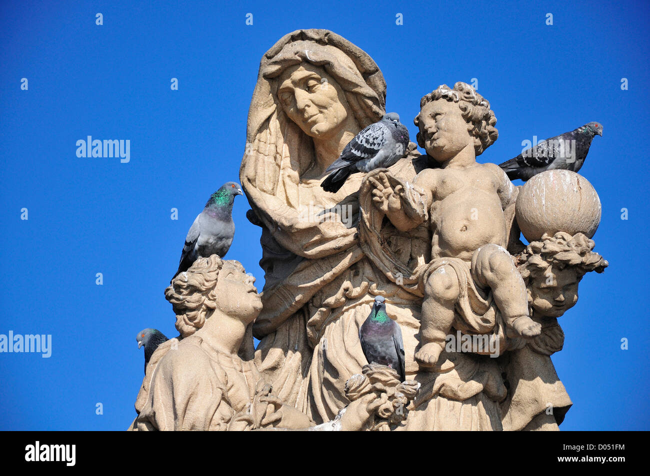 Prague, Czech Republic. Charles Bridge / Karluv most. Statue: St Anne with young Christ. Pigeons Stock Photo