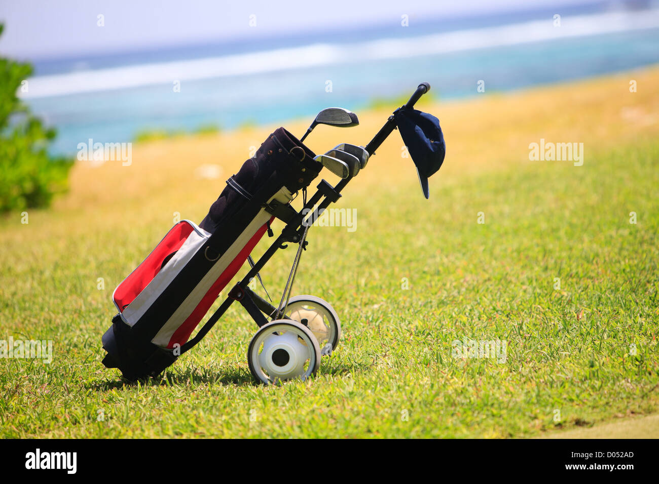 Golf bag on coastal field Stock Photo