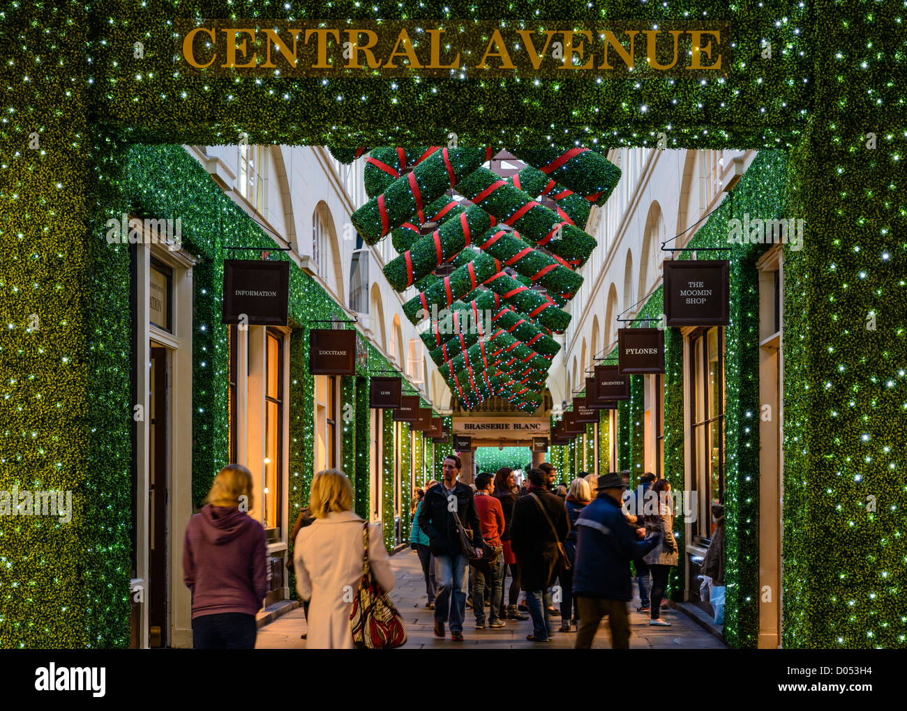 Shoppers at Christmas decorated market in Central Avenue, Covent Garden, London, England, UK, 2012 Stock Photo