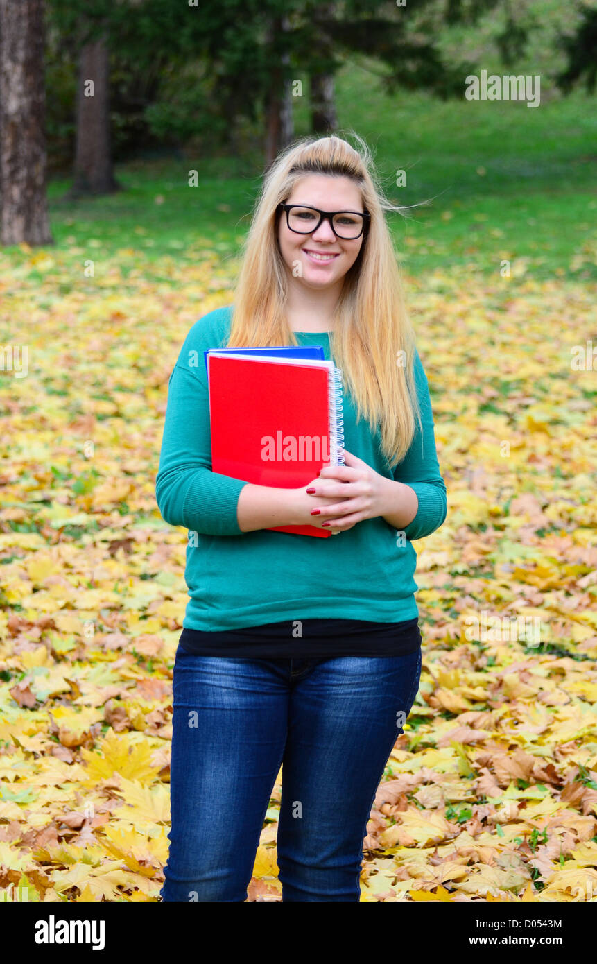 Portrait of happy blonde student girl Stock Photo - Alamy