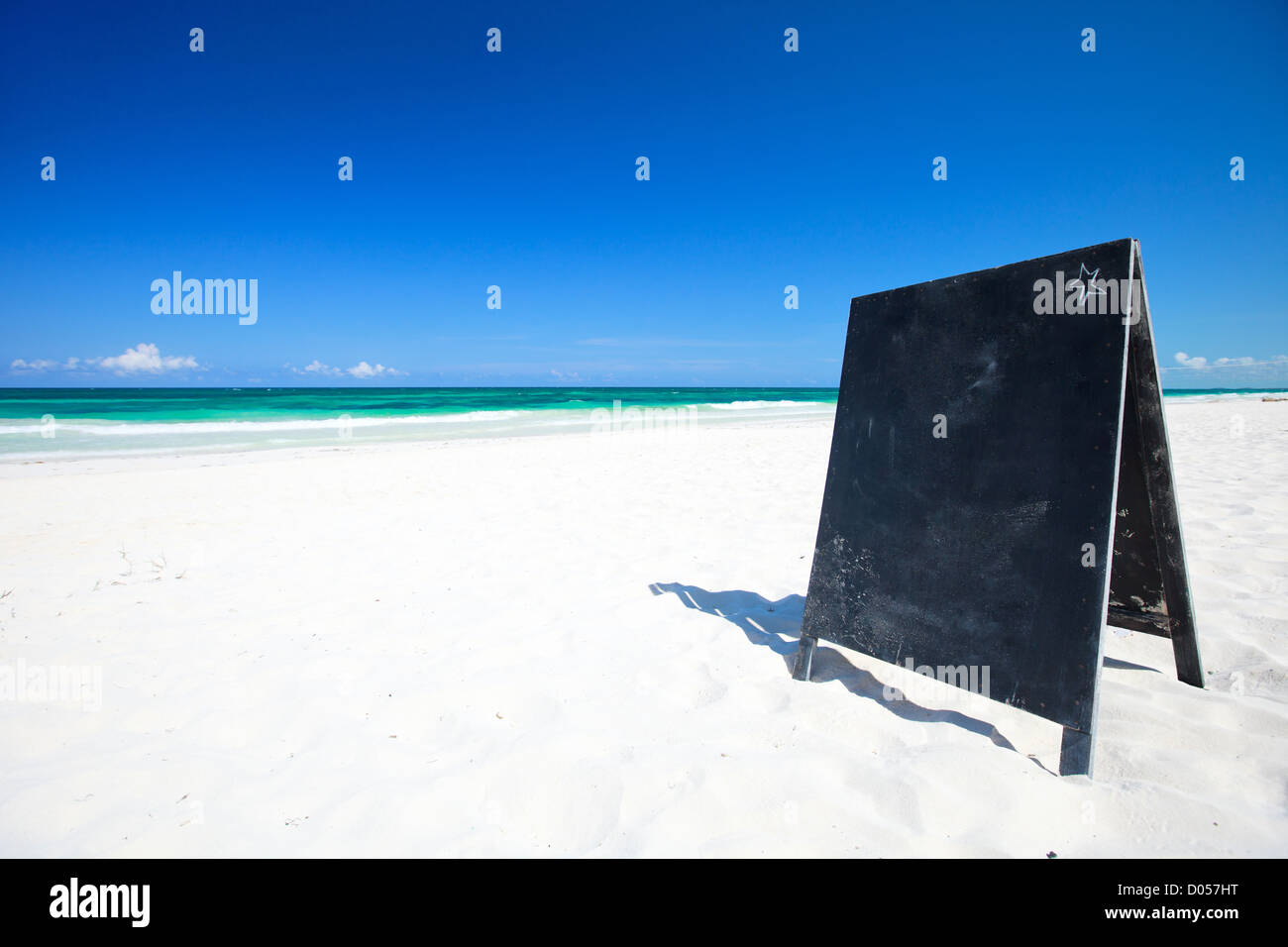 Blackboard on tropical beach Stock Photo