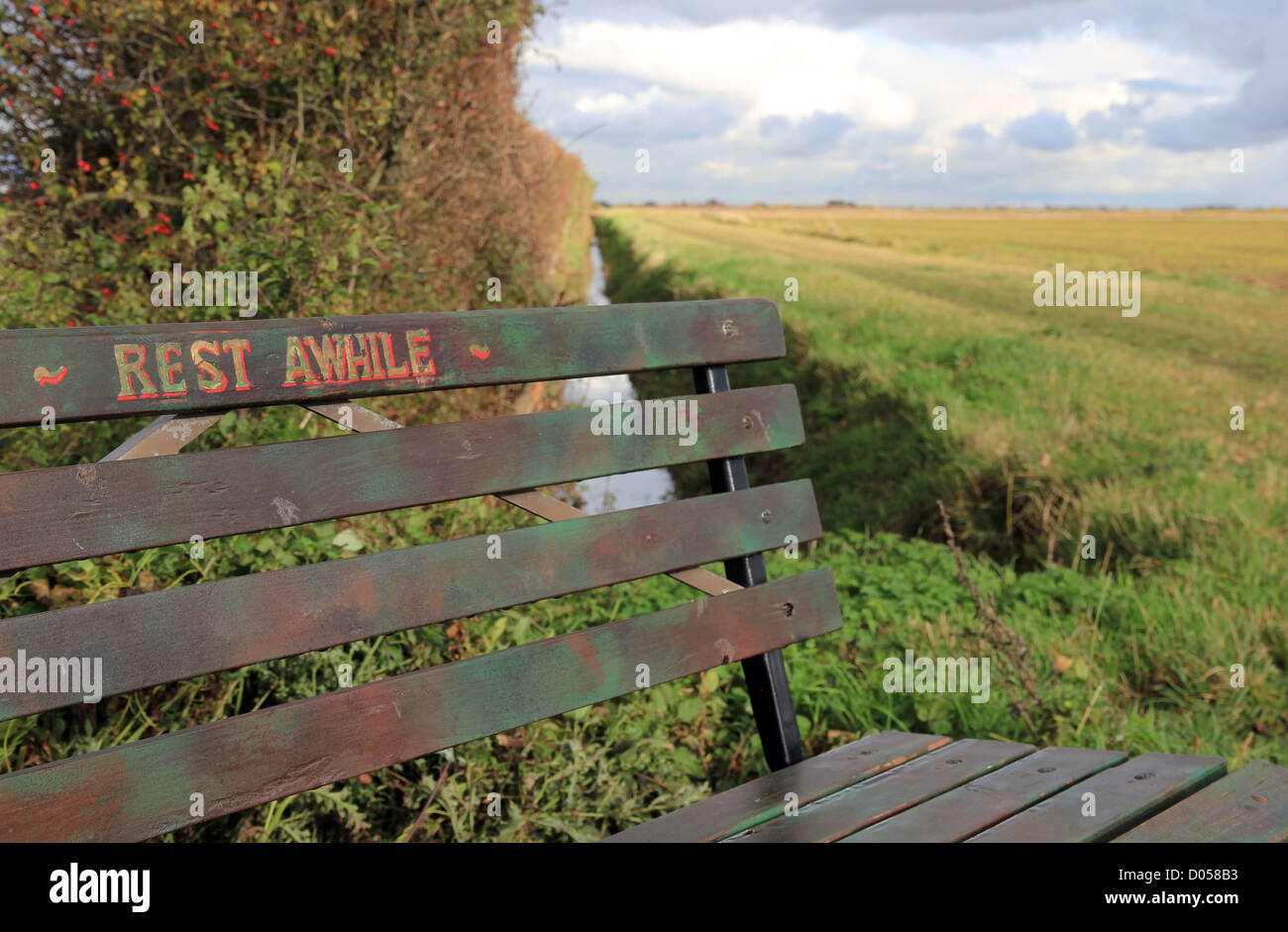 bench on footpath Impington, Histon, Cottenham, east anglian fenland, Cambridgeshire England UK Stock Photo