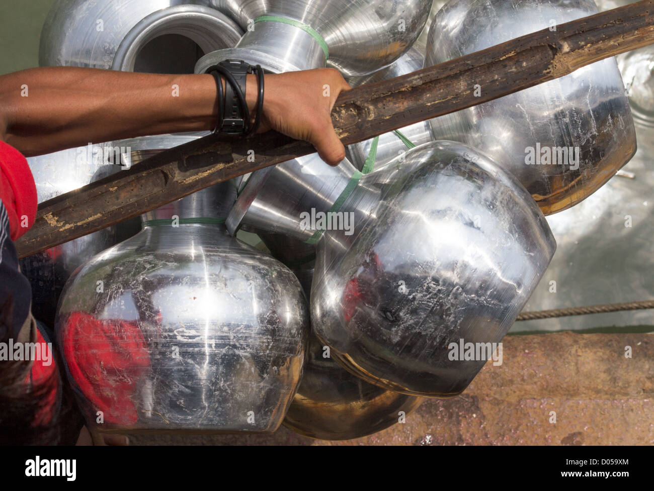 Water carriers typical of the type used in Kachin State. Stock Photo
