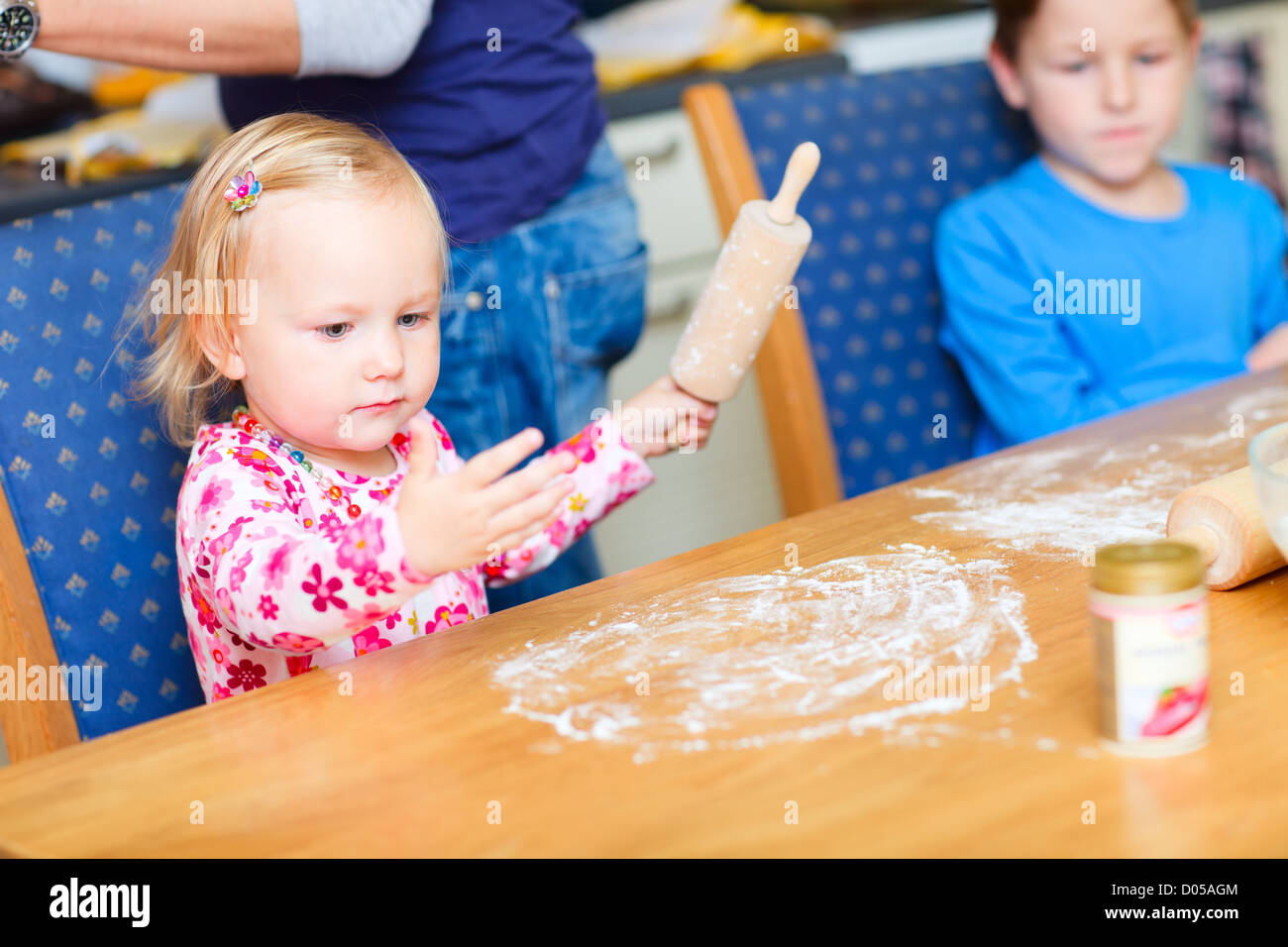 Two kids baking Stock Photo - Alamy