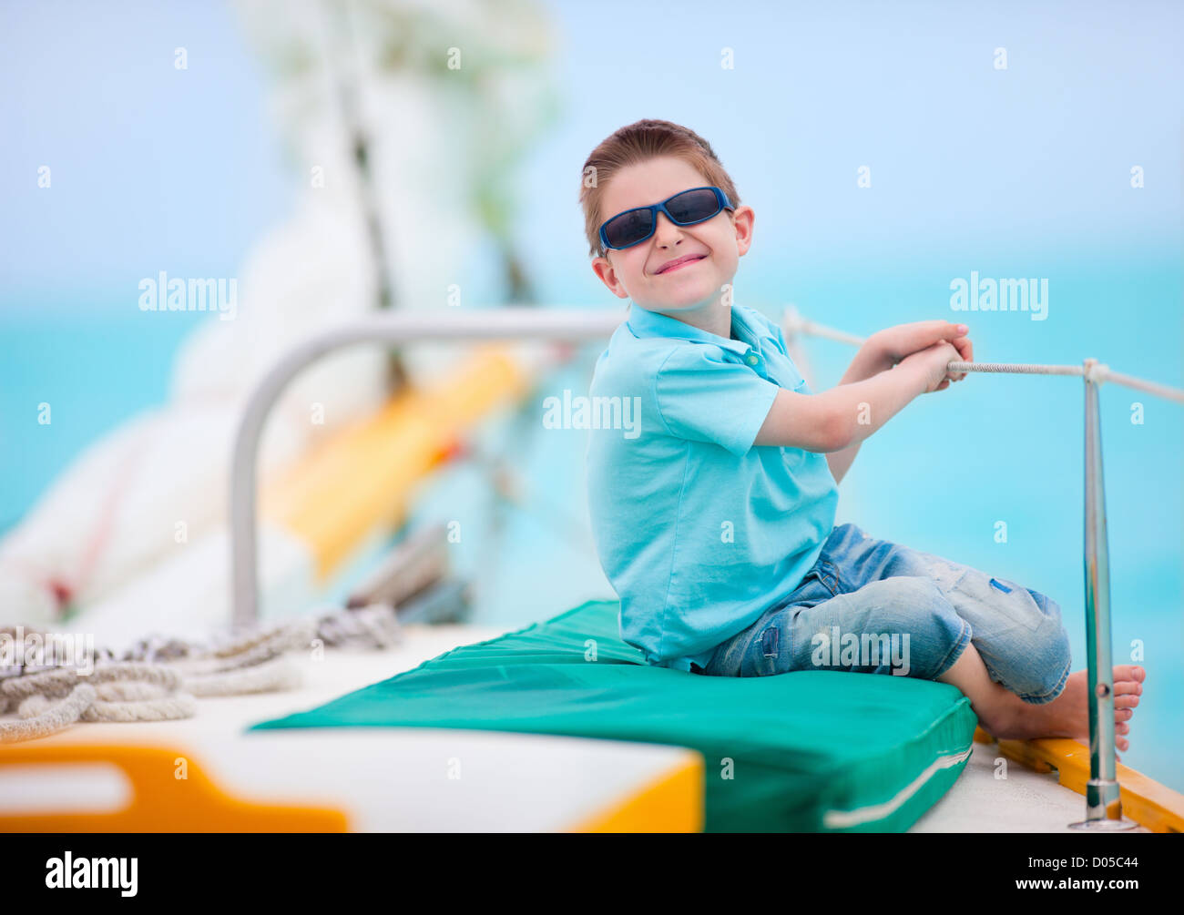 Cute boy on luxury yacht Stock Photo Alamy