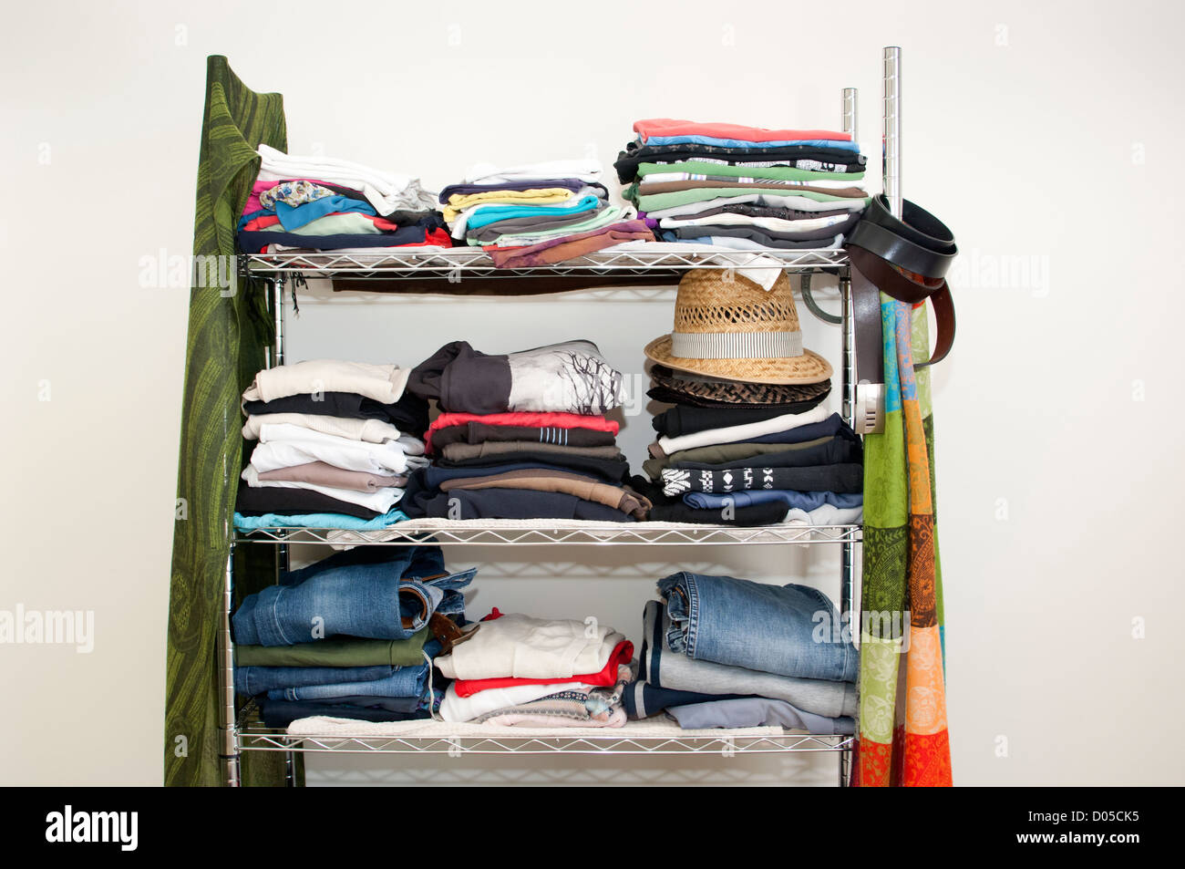 Clothes rack with stacked clothes for male and female, with jeans ...