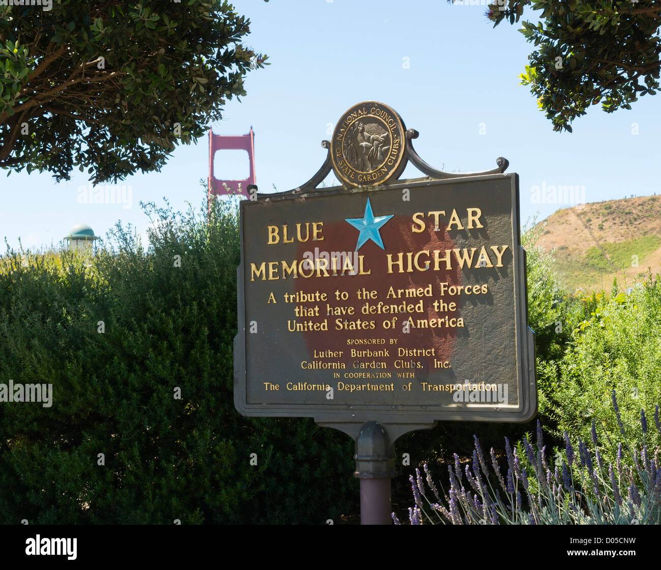 San Francisco - the Golden Gate bridge seen from the North viewpoint over Blue Star Memorial Highway plaque. Stock Photo