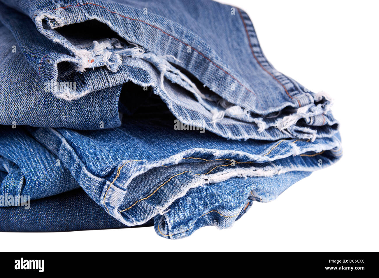 Torn blue jeans hem isolated on white Stock Photo