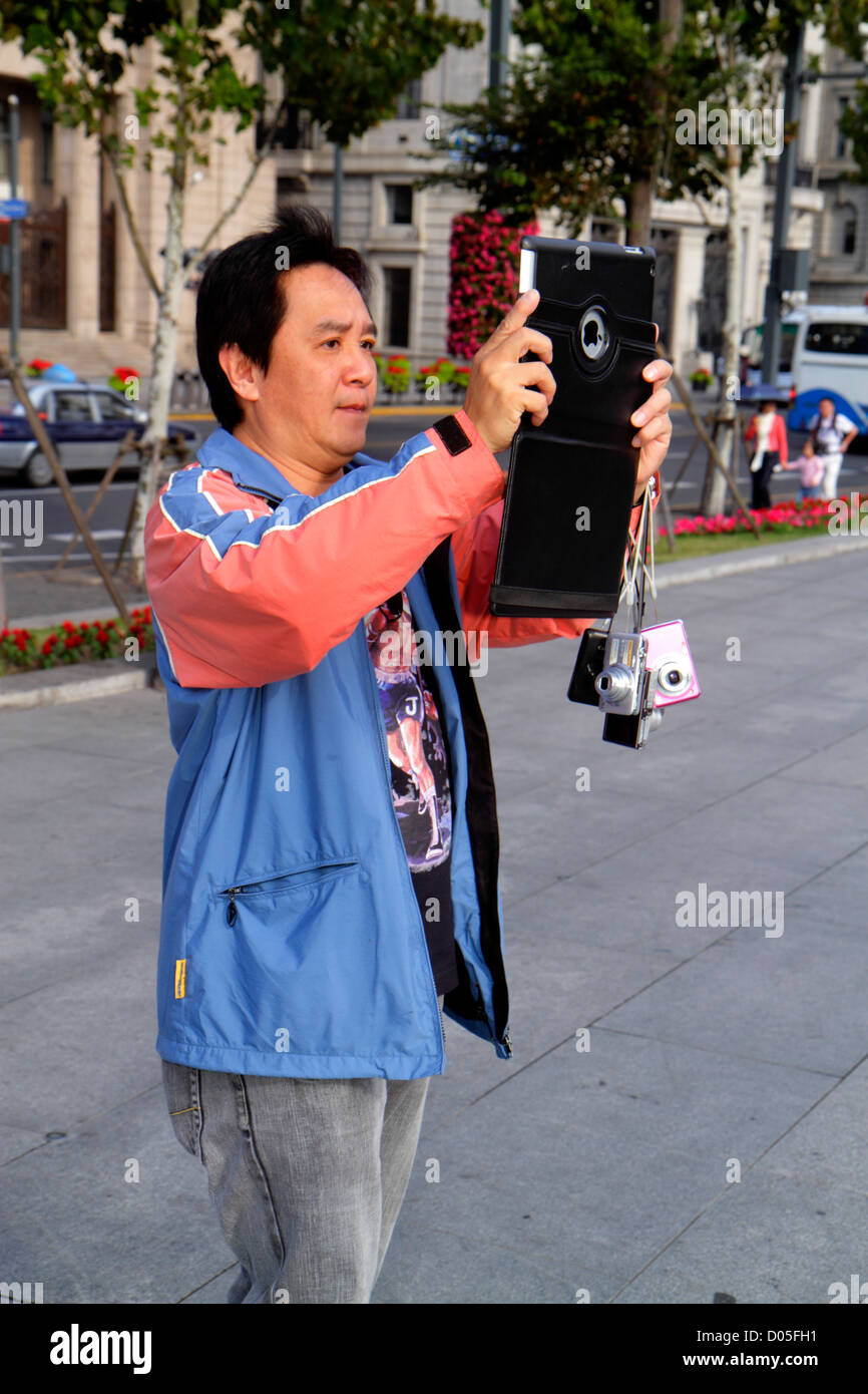 Shanghai China,Asia,Chinese,Oriental,Huangpu District,The Bund,Zhongshan Road,Asian Asians,man men male adult adults,cameras,taking pictures,National Stock Photo