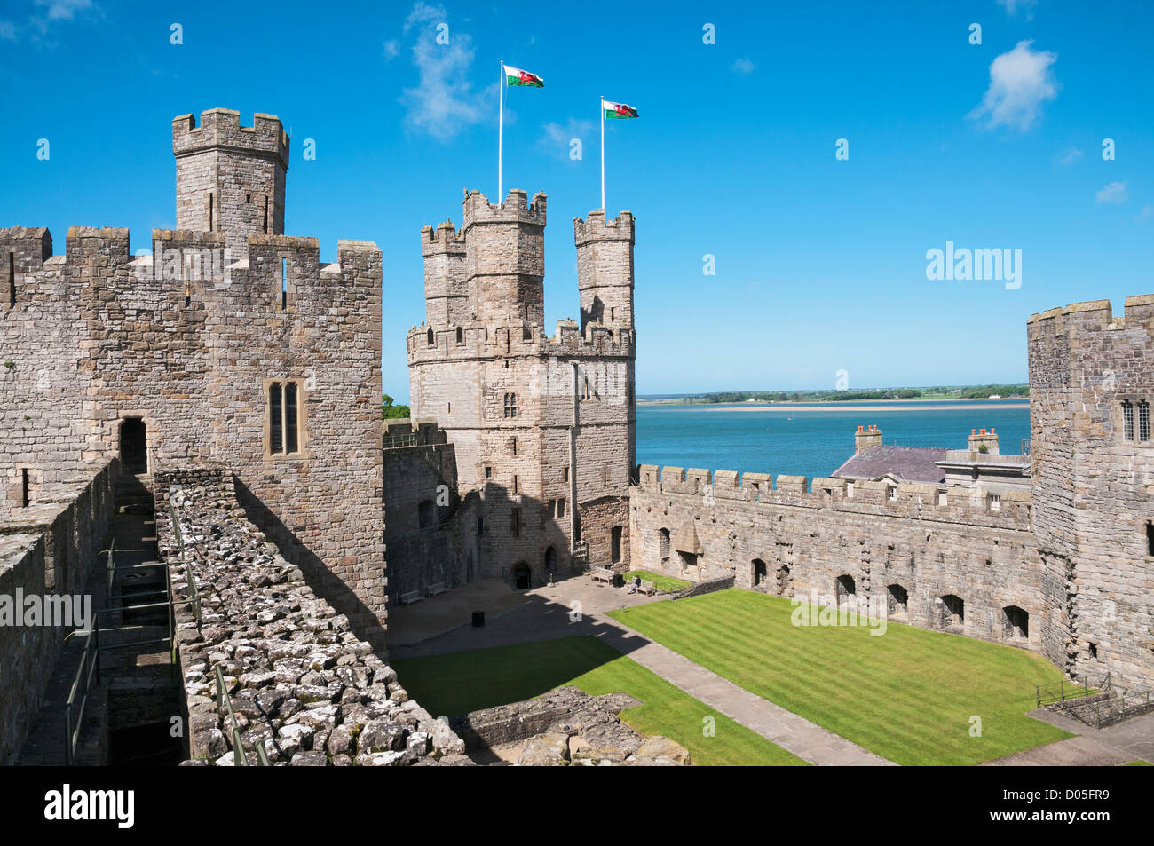 Wales, County Gwynedd, Caernarfon Castle, Welsh flags atop Eagle Tower