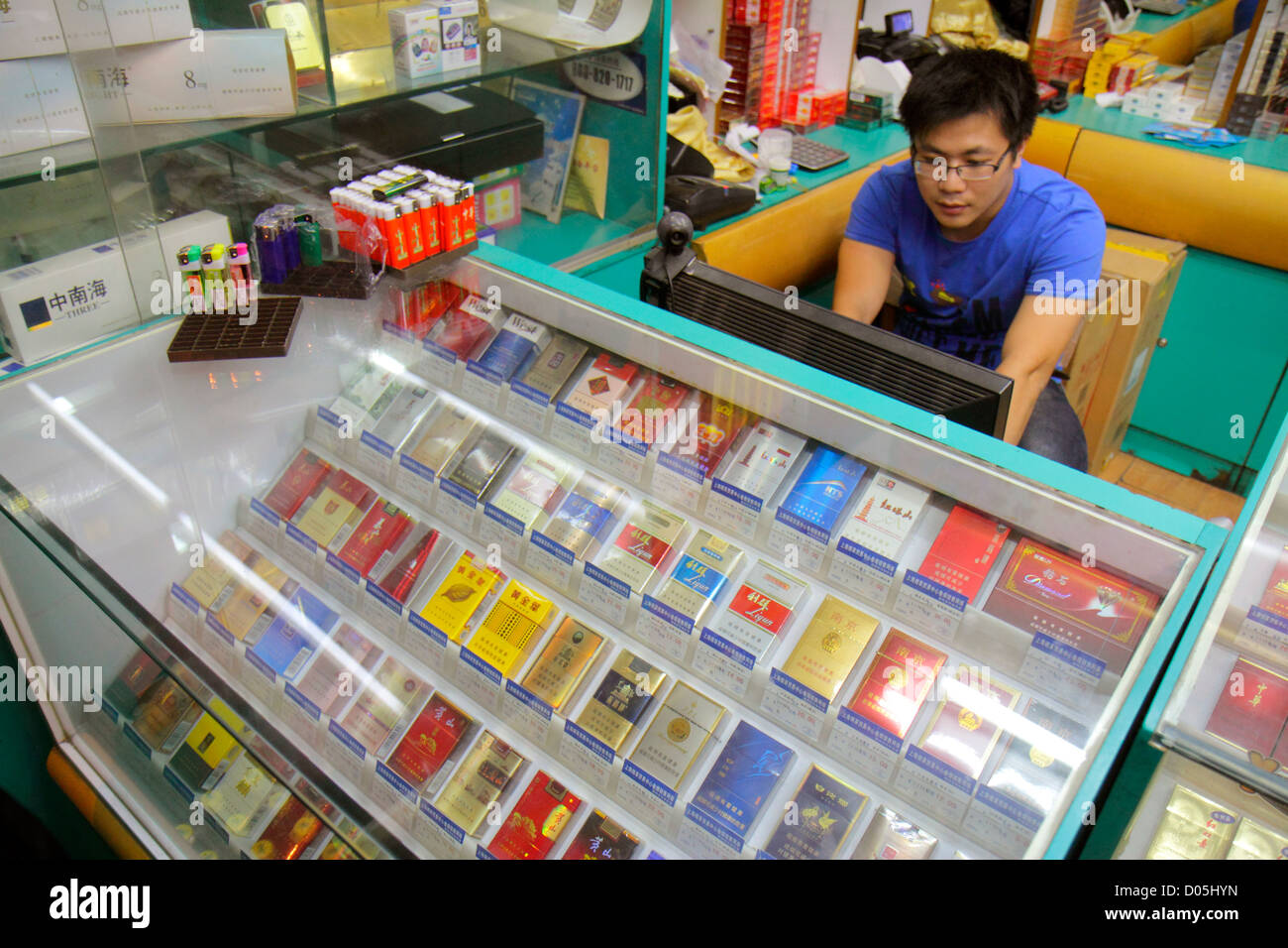 Shanghai China,Chinese Huangpu District,Sichuan Road,tobacco smoke shop,cigarettes,domestic,pack,display case sale,Asian man men male adult adults,cle Stock Photo