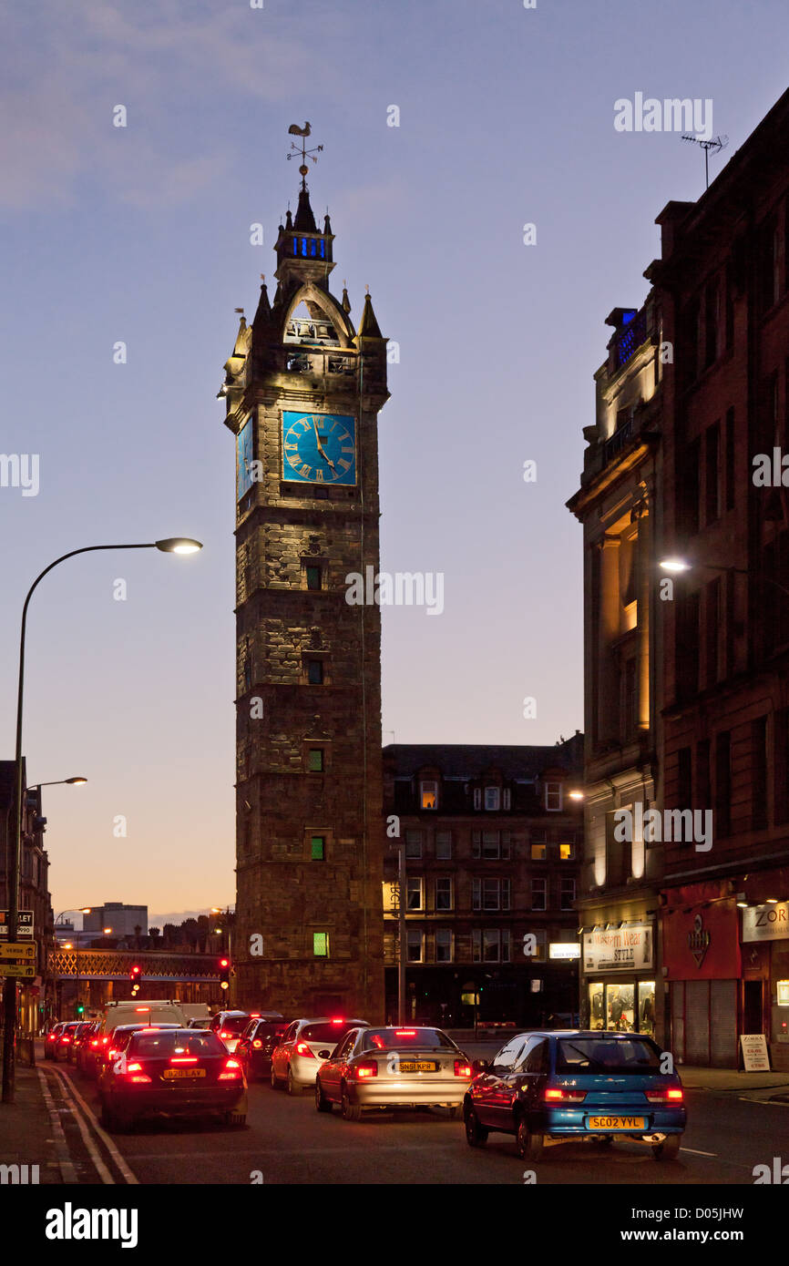 The Tolbooth Steeple at Glasgow Cross at sunset, with city traffic. It was completed in 1626 and repaired in 1842. Scotland, UK Stock Photo