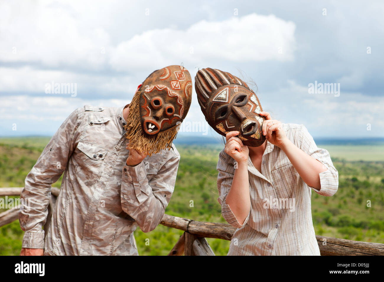Couple in African masks Stock Photo