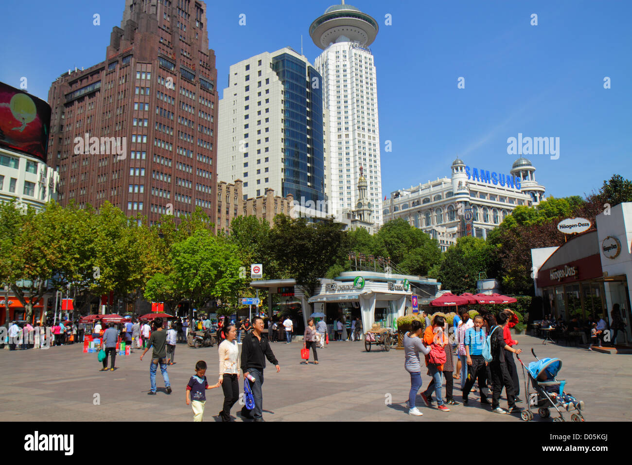 Shanghai China,Oriental,Huangpu District,Nanjing Road,People's Square,plaza,Asian man men male adult adults,father,mother,woman female women,son,boy b Stock Photo