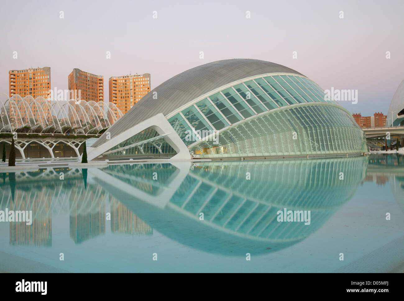 City of Arts & Sciences, Valencia, featuring the Hemisferic cinema reflected in the quiet evening light. Stock Photo