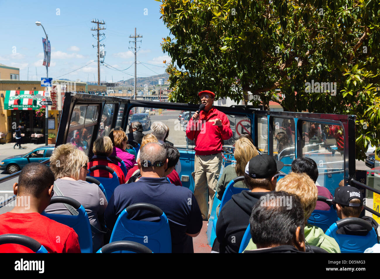 San Francisco open top hopon hopoff city tour bus. Guide using microphone Stock Photo Alamy