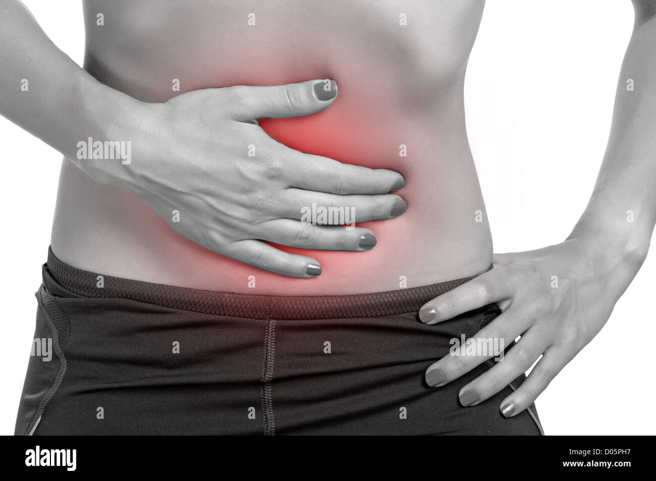 Woman suffering from stomach pain, isolated in white. Stock Photo
