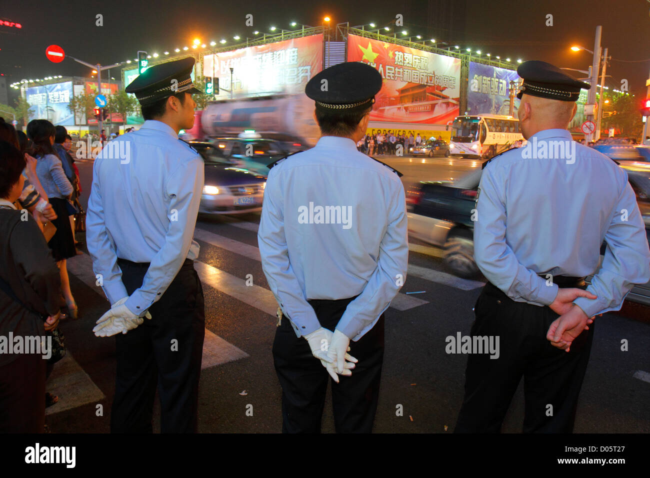 Shanghai China,Huangpu District,East Nanjing Road,National Day Golden Week,night evening,Asian man men male adult adults,police,policeman,Mandarin,han Stock Photo
