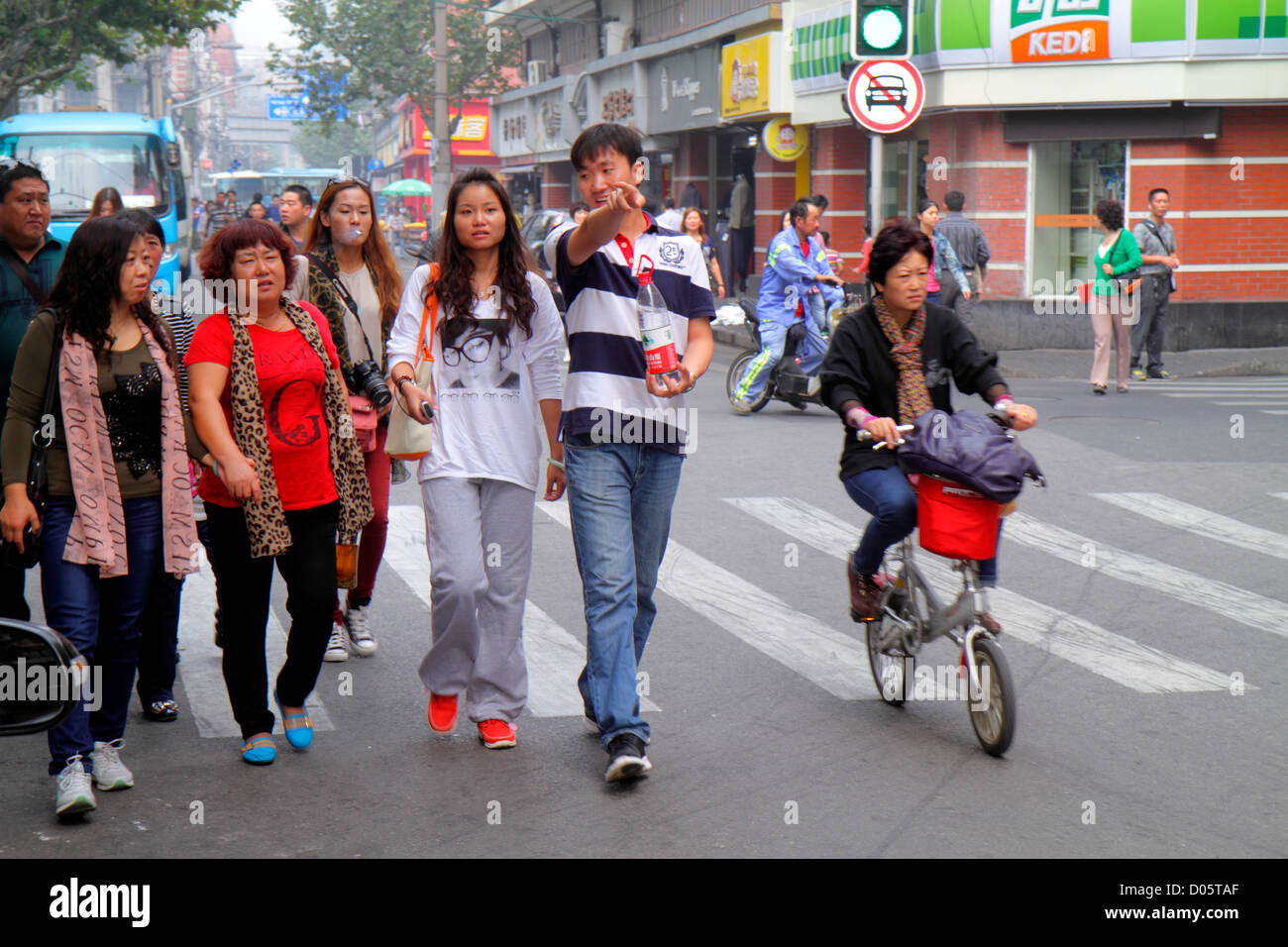 Chinese women riding bicycle hi-res stock photography and images - Alamy