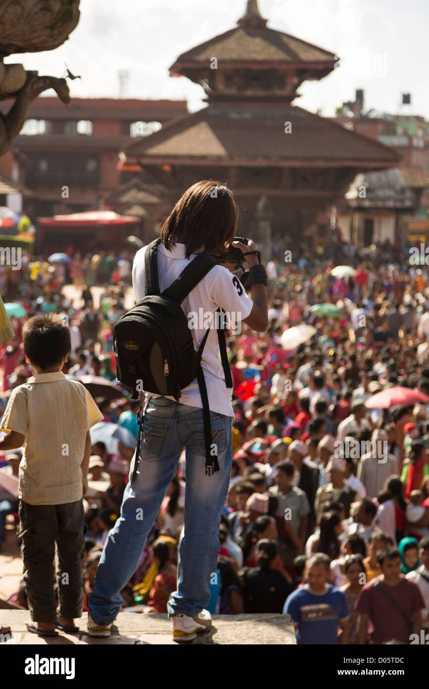 A photo of a photographer during a festival in Bhaktapur, Nepal Stock Photo