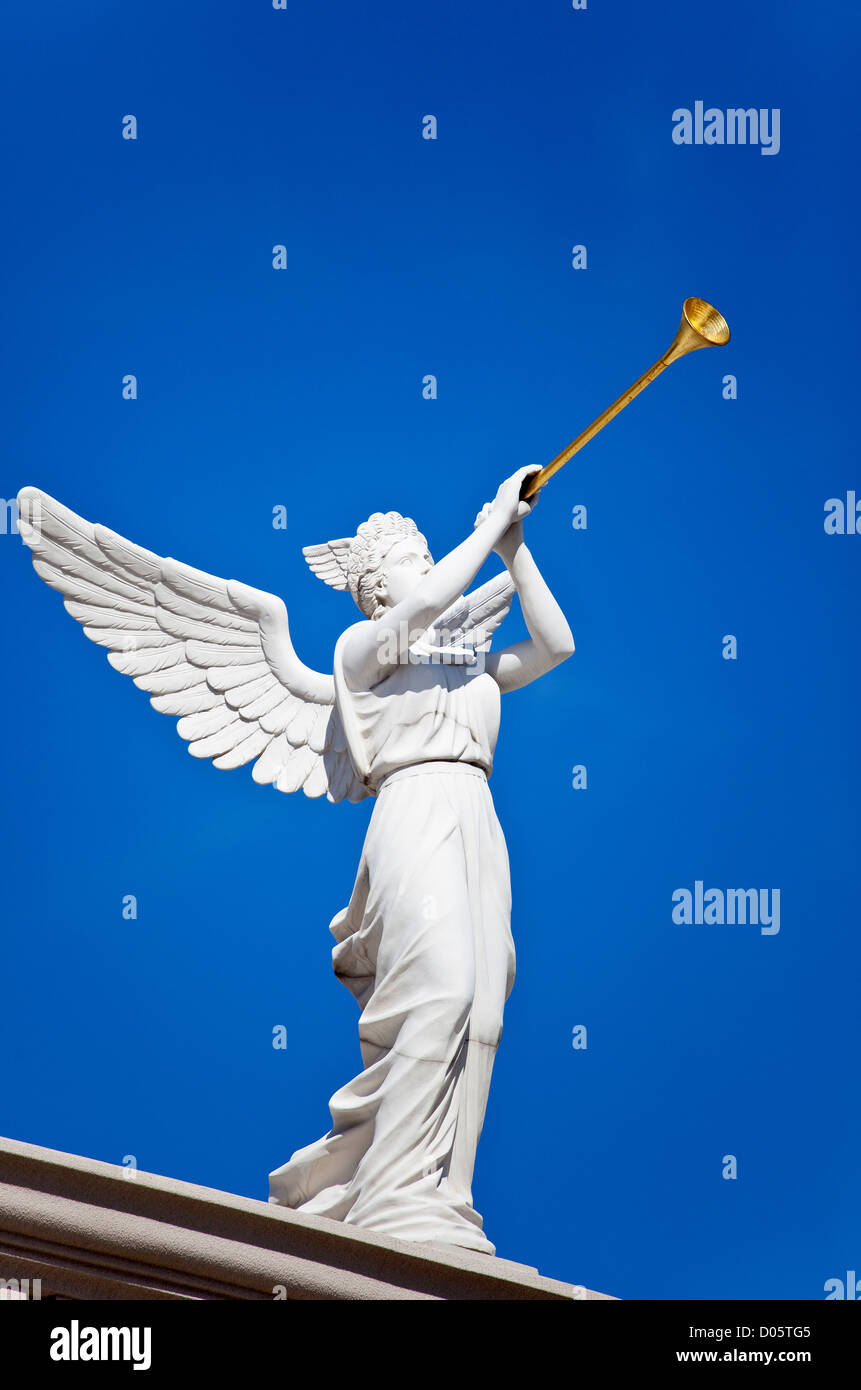 Statue of an Angel Blowing a Trumpet Stock Photo
