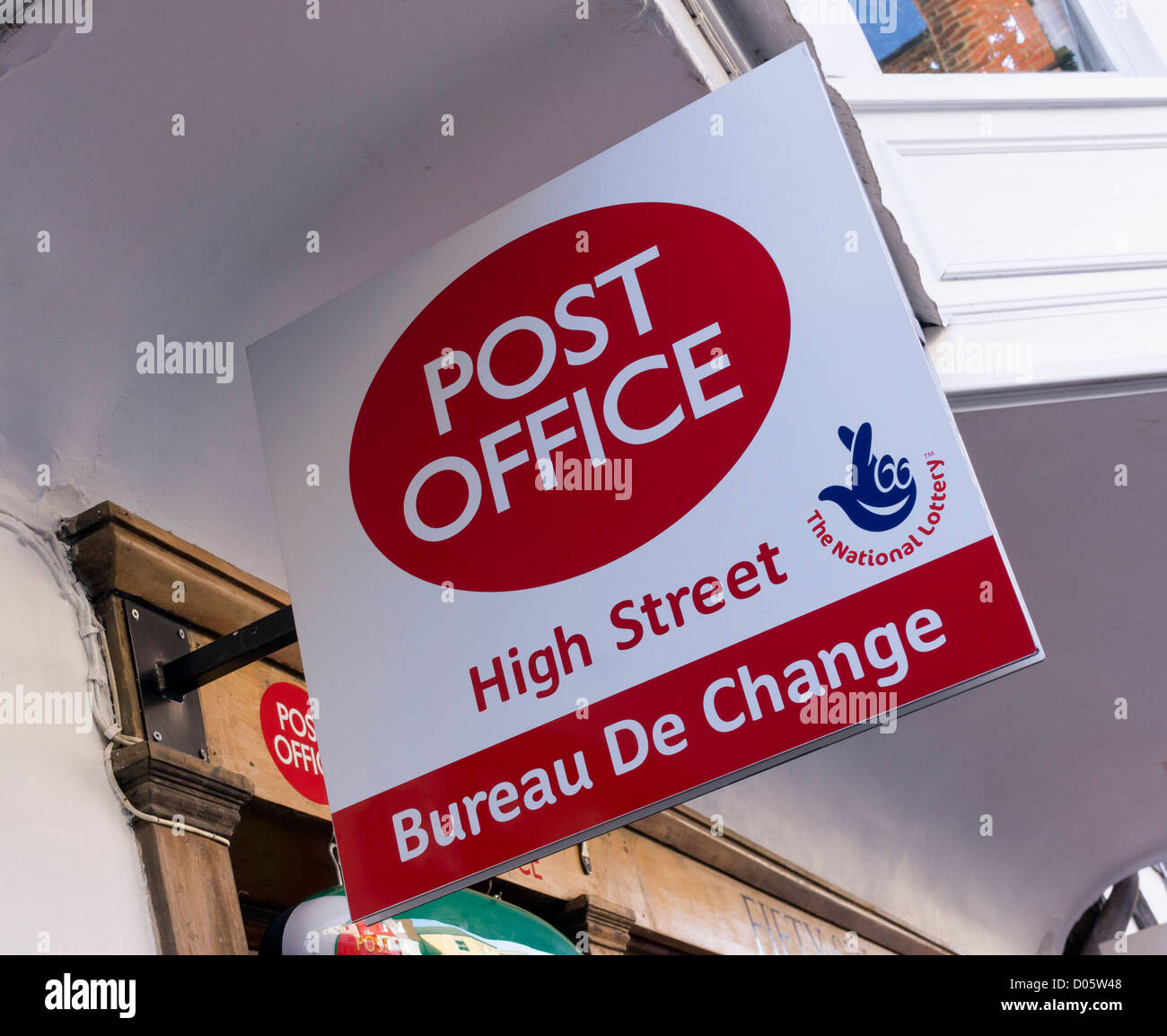 Post Office sign advertising Bureau De Change currency exchange service and UK national lottery tickets Stock Photo