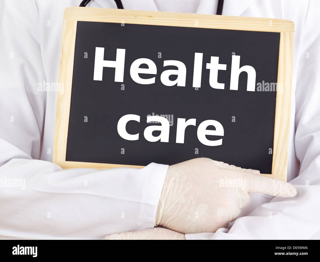 Doctor shows information on blackboard health care Stock Photo Alamy