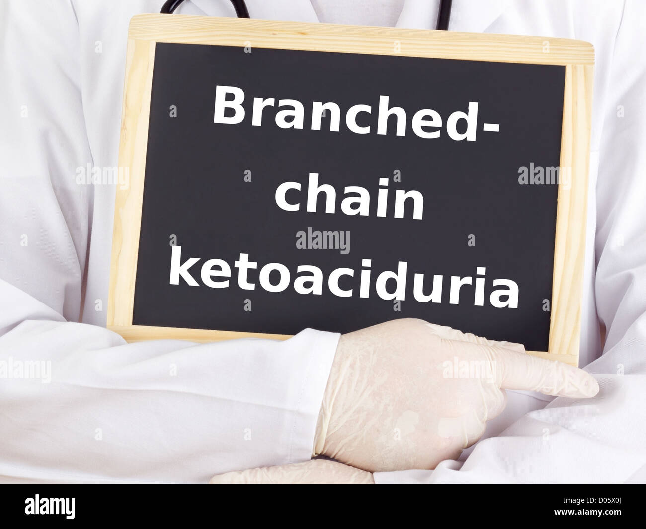 Doctor shows information on blackboard branchedchain ketoaciduria