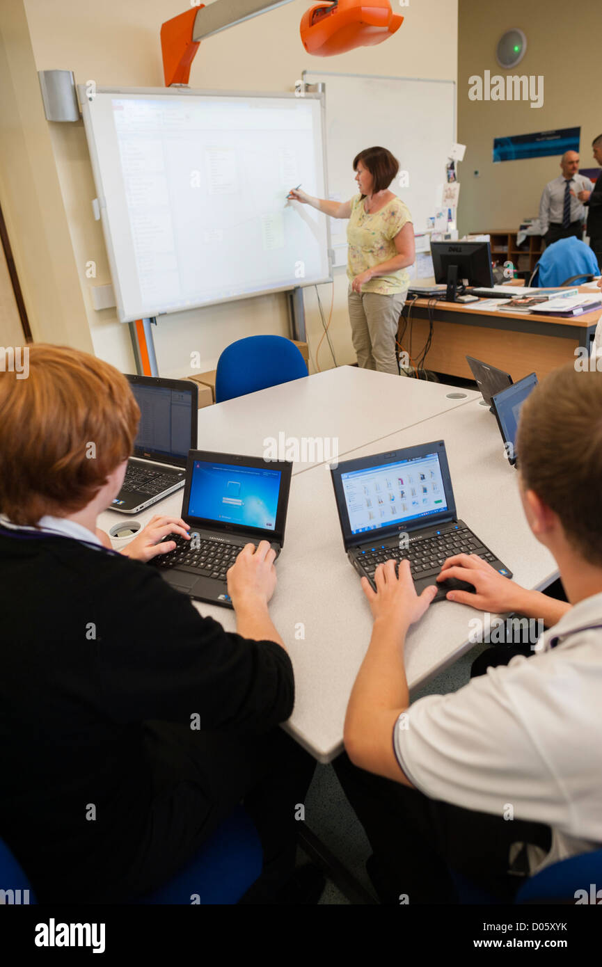 A level pupils using tablet notebook computers in class at a secondary