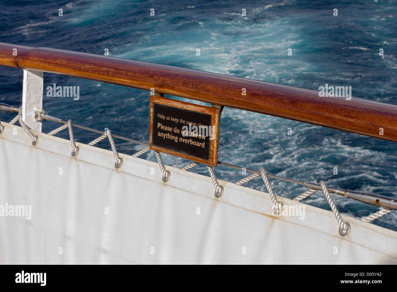 Notice at the stern of the Cunard cruise ship Queen Mary 2 advising not to pollute the sea by throwing anything overboard. Stock Photo