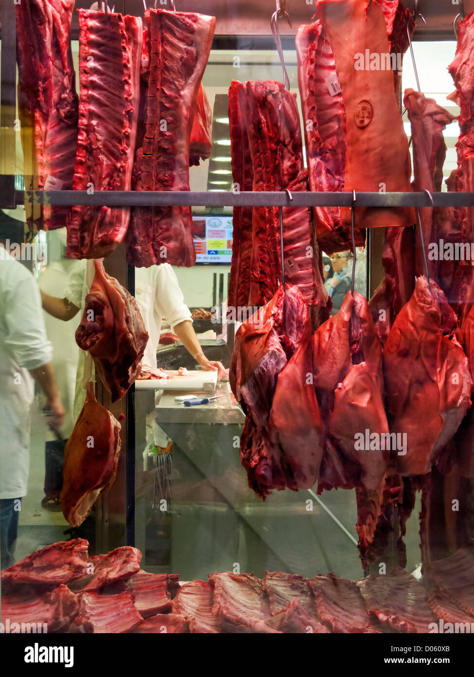 Local butcher's shop with raw cuts of meat on the storefront Stock Photo