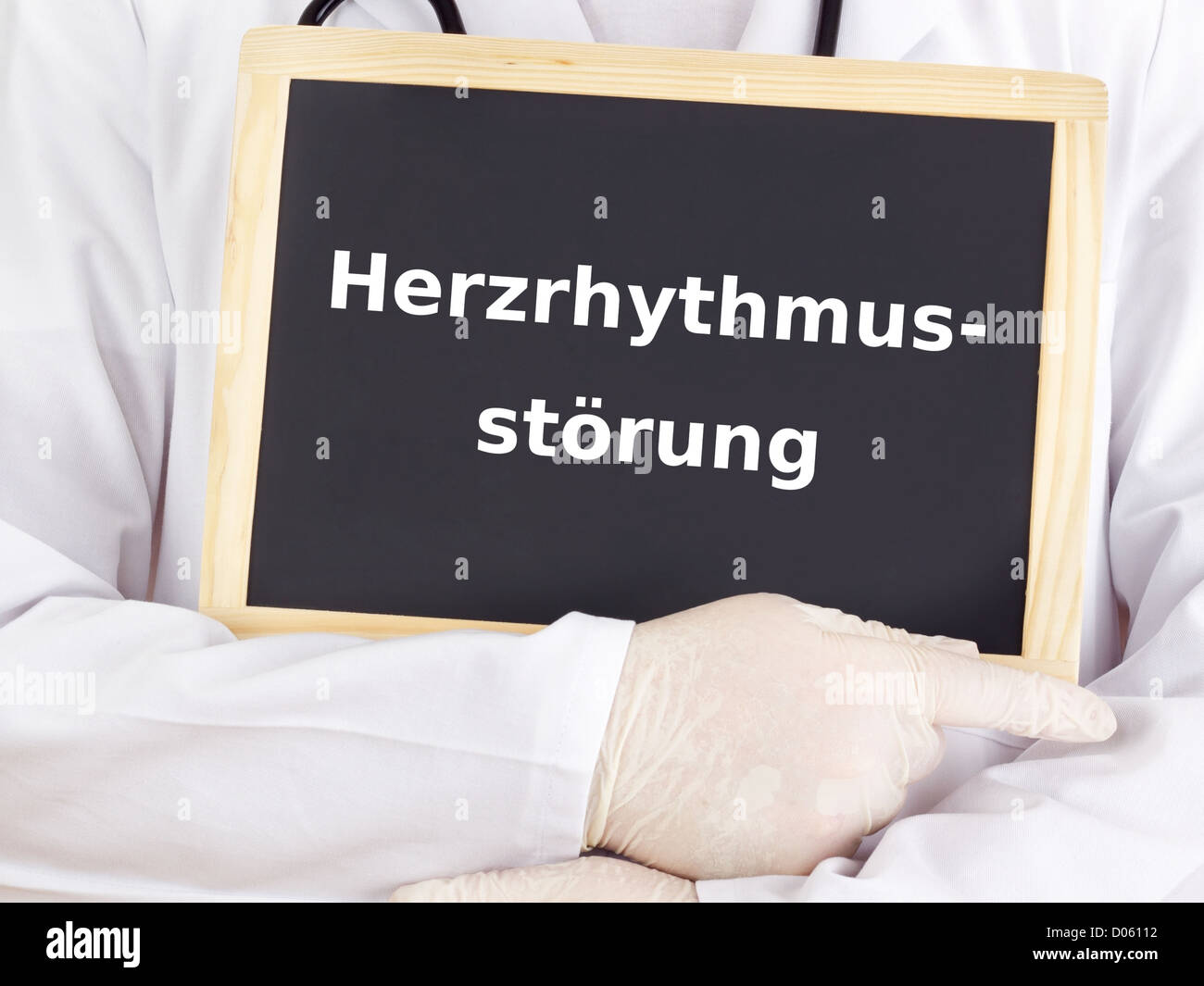 Doctor shows information on blackboard: arrhythmia Stock Photo