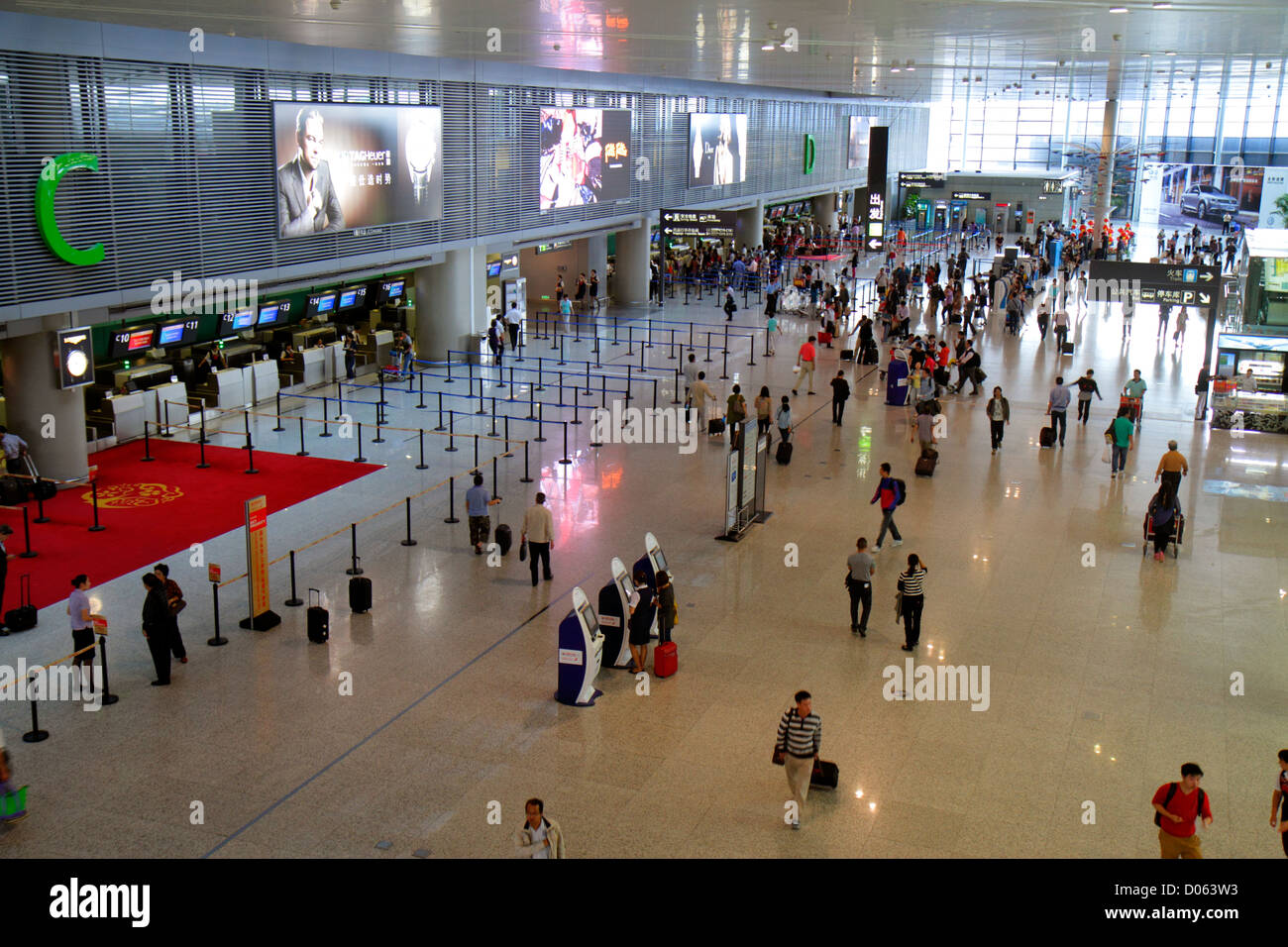 Shanghai China,Chinese Changning District,Hongqiao Airport,Terminal 2,SHA,overhead view,passenger passengers rider riders,travelers,self service kiosk Stock Photo