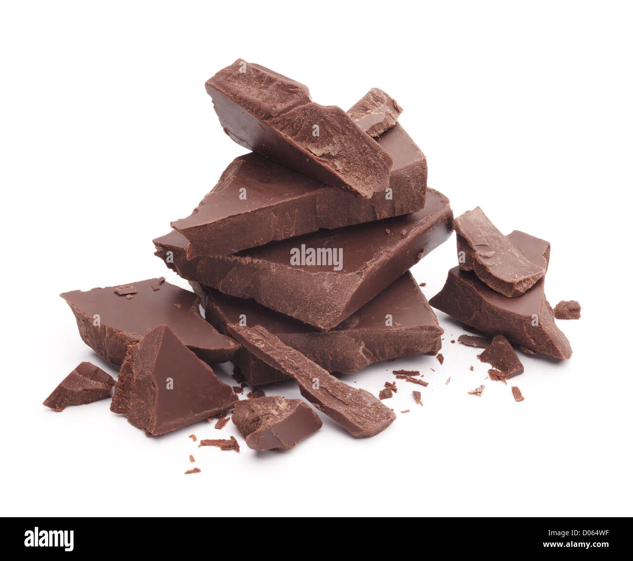 heap of broken pieces of chocolate isolated on white Stock Photo