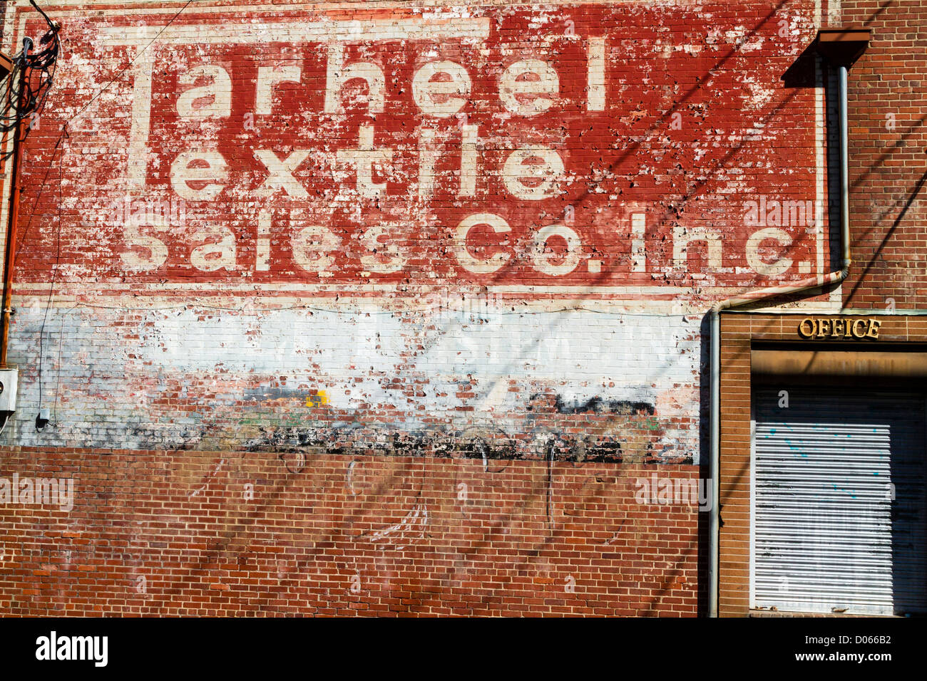 Tarheel Textile Co painted sign on old building in Winston-Salem NC Stock Photo